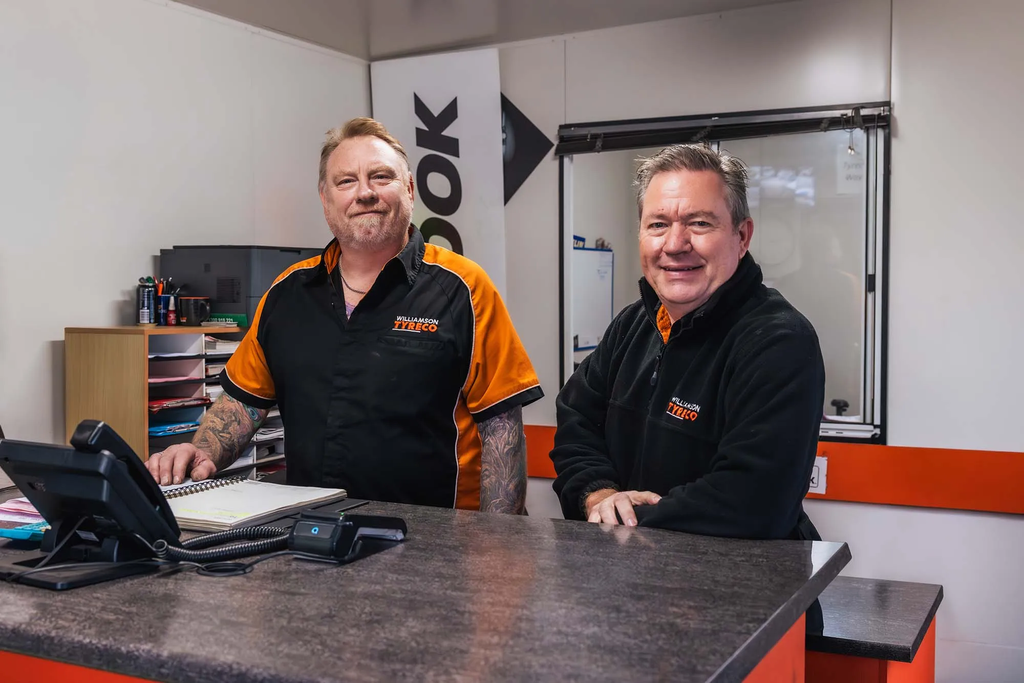 Two Williamson Tyreco team members at the service counter